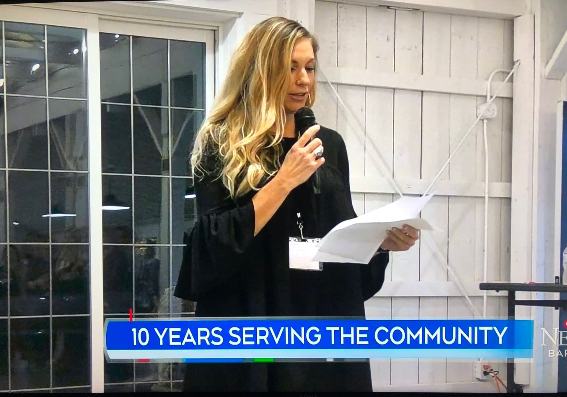 A Level Up facilitator speaking at a community event featured on the local news for ten years of serving the community.